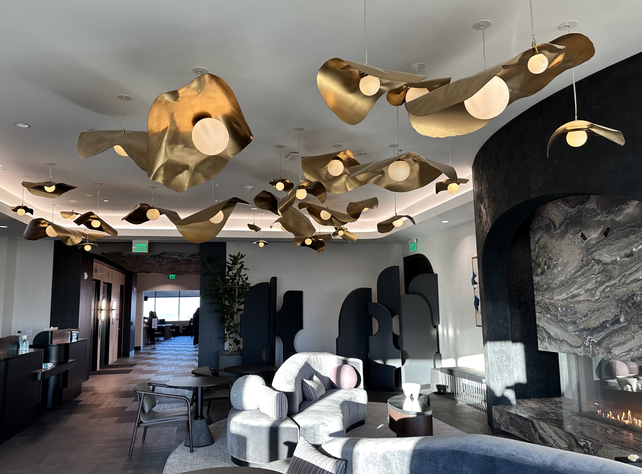 Luxury Lounge With Gold Chandeliers And Marble Fireplace