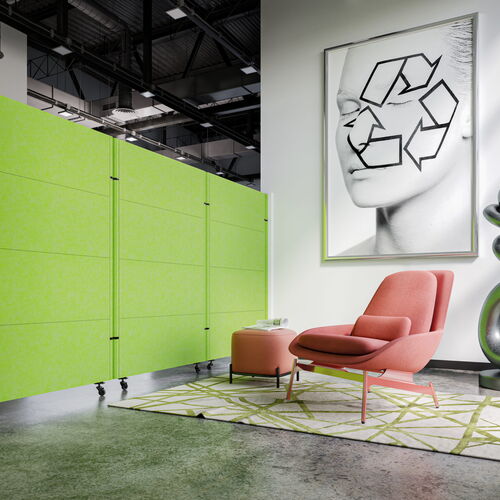Contemporary Office Lounge Featuring a Pink Chair, Green Divider, and Artistic Sculptures