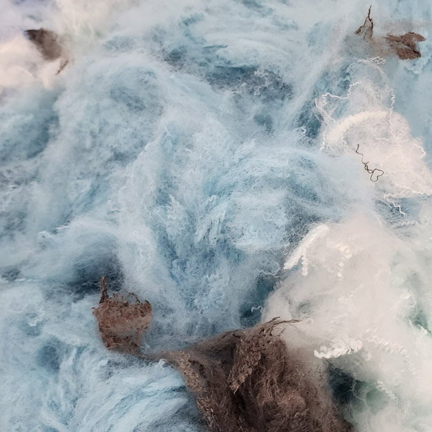 Close-Up of a Textured Fabric with Blue and Brown Tones